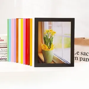 Detail of colorful wooden photo frames set with a modern minimalist square structure