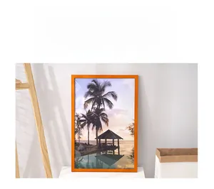 Detail of 16-inch solid wood photo frame with tropical beach art in a home setting