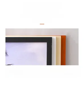Detail showing various colors of modern pine wood frames including black, white and orange