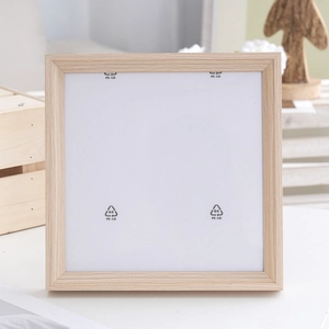 Square light wood picture frame with natural grain shown in a warm home setting