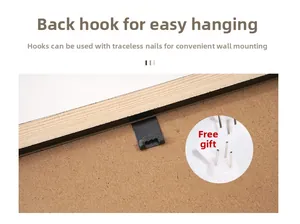 Detail view of pine wood frame back featuring sawtooth hanger and non-marking nails