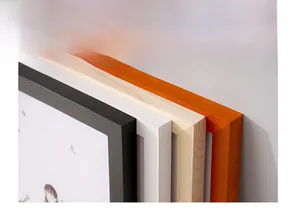 Detailed close-up of pine wood frame corners in black, white, and natural wood grain finishes
