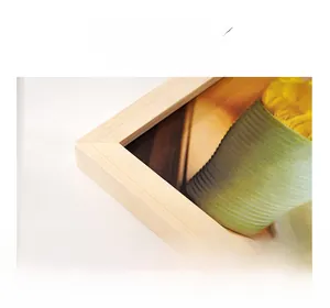 Detailed macro view of solid wood picture frame corner with natural grain texture