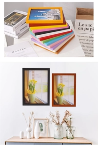 Close-up of colorful wooden picture frames showing wall-mounted and tabletop display options