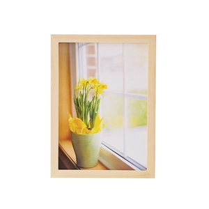 Minimalist solid wood picture frame with natural grain finish and white background