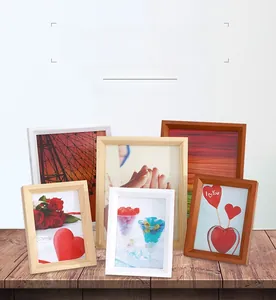 Close-up of minimalist wooden picture frames in white, natural, and walnut wood finishes