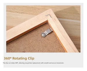 Close-up of 360-degree rotating metal clips on a solid wood frame backboard
