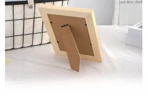 Detail of wooden photo frame back with adjustable stand for vertical or horizontal display