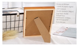 Solid wood photo frame back view showing stable support stand and metal clips