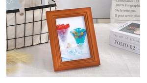 Detail of Nordic solid wood photo frame with layered textures and retro brown finish