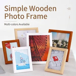Minimalist solid wood picture frames in white, natural, and brown for desk display