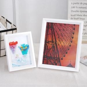 Minimalist white solid wood picture frames in two sizes for wall or tabletop display