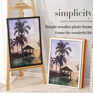 Minimalist solid wood picture frames in black, white, and natural wood on easel stand