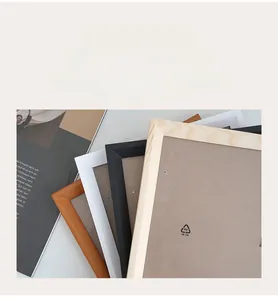 Close-up of stacked wooden photo frames showing side profiles and multiple color options