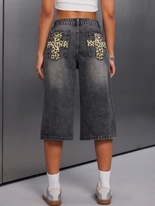 Women's high waist retro grey denim shorts featuring leopard print cross patches