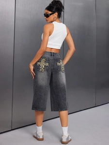 Women's high waist denim shorts with leopard cross patch detail and retro washed finish