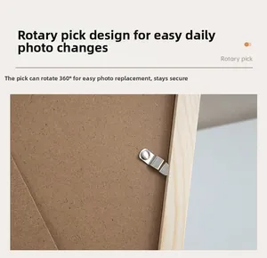 Detail of metal swivel clips on wooden picture frame back for easy photo change