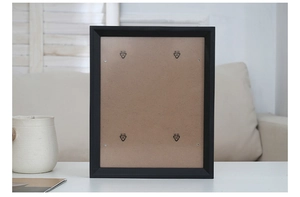 Rear view of minimalist black wooden photo frame with secure hardware and brown backing