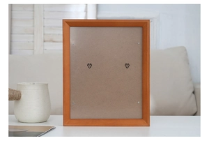 Close-up of the wooden photo frame backboard with secure metal clips and fiberboard