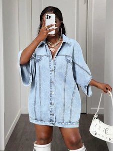 Oversized light blue denim shirt dress for women with short sleeves and flap pockets