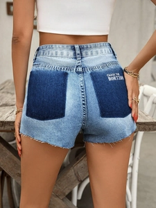Women's light blue denim shorts with two-tone pockets and raw hem details