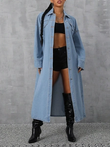 Full view of light blue denim trench coat with metallic buttons and large pockets