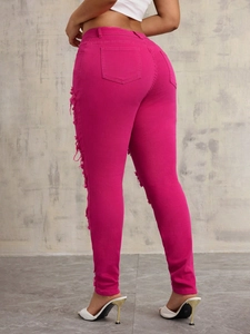 Slim fit rose pink ripped jeans for women featuring distressed details and back pockets