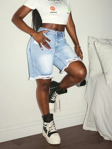Women's light blue high-waisted denim shorts with ripped holes and frayed raw hem detailing