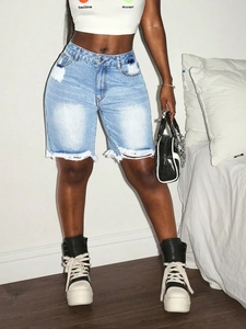 High waist light blue distressed denim shorts with frayed hems and ripped details