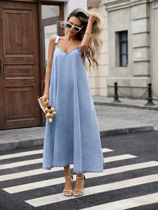Women's light blue denim V-neck maxi dress with spaghetti straps and an A-line silhouette