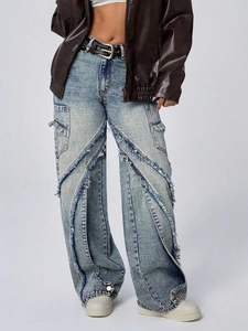 Light blue wash wide leg denim jeans with frayed patchwork design and raw hem details