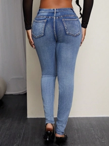 Slim fit light blue women's skinny jeans with butt-lifting design and wash texture