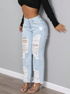 Jeans in denim azzurro strappati a vita media con gamba dritta e dettagli logori chic
