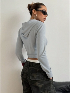 Women's gray long sleeve zip-up hooded sweatshirt in a cropped street fashion style