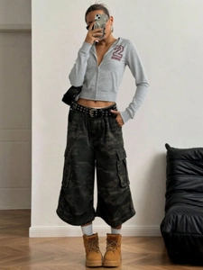 Women's gray slim zip hoodie with street style camo cargo pants and casual boots