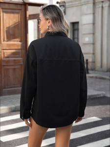 Oversized black cotton canvas shirt jacket for women in a minimalist street style
