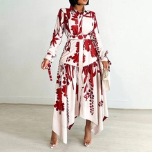 Detail of red floral shirt dress featuring shirt collar and asymmetric handkerchief hem