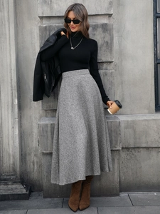 Elegant grey high-waisted A-line wool blend midi skirt with a flowy draped silhouette