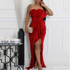 Detail of red sequin evening gown showing off-shoulder cut and asymmetrical pleated bodice