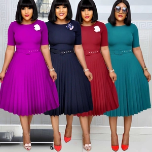 Short sleeve pleated dress with round neck and belt shown in four various colors