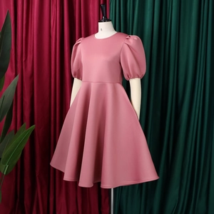Detail view of pink puff sleeves and high-quality fabric on elegant A-line dress