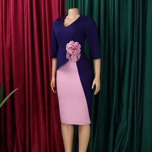Detailed view of 3D pink rose decoration and tassel fringe on V-neck dress