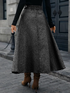 Detail of high-waist grey metallic wool A-line skirt with side buttons and back elastic