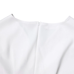 Close-up detail of smooth white fabric neckline with a neat invisible back zipper