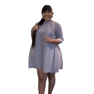 Elegant light blue plissé pleated mini dress with a high neck and half sleeves