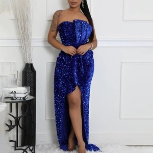 Detailed view of shimmering navy blue sequins and high side slit on the evening gown