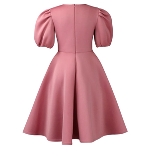 Rear view of pink puff sleeve dress showing concealed zipper and cinched waist design