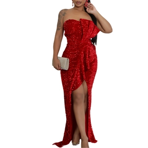Detailed close-up of a glamorous red sequin off-shoulder evening dress with high side slit