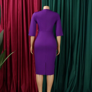 Back view of a purple pleated midi dress featuring a slit hem and half sleeves