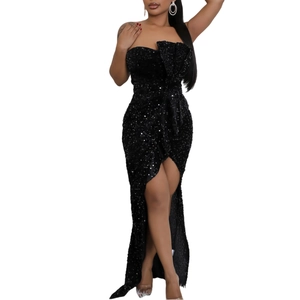 Detail of elegant black sequin evening gown with off-shoulder ruffle and thigh-high slit